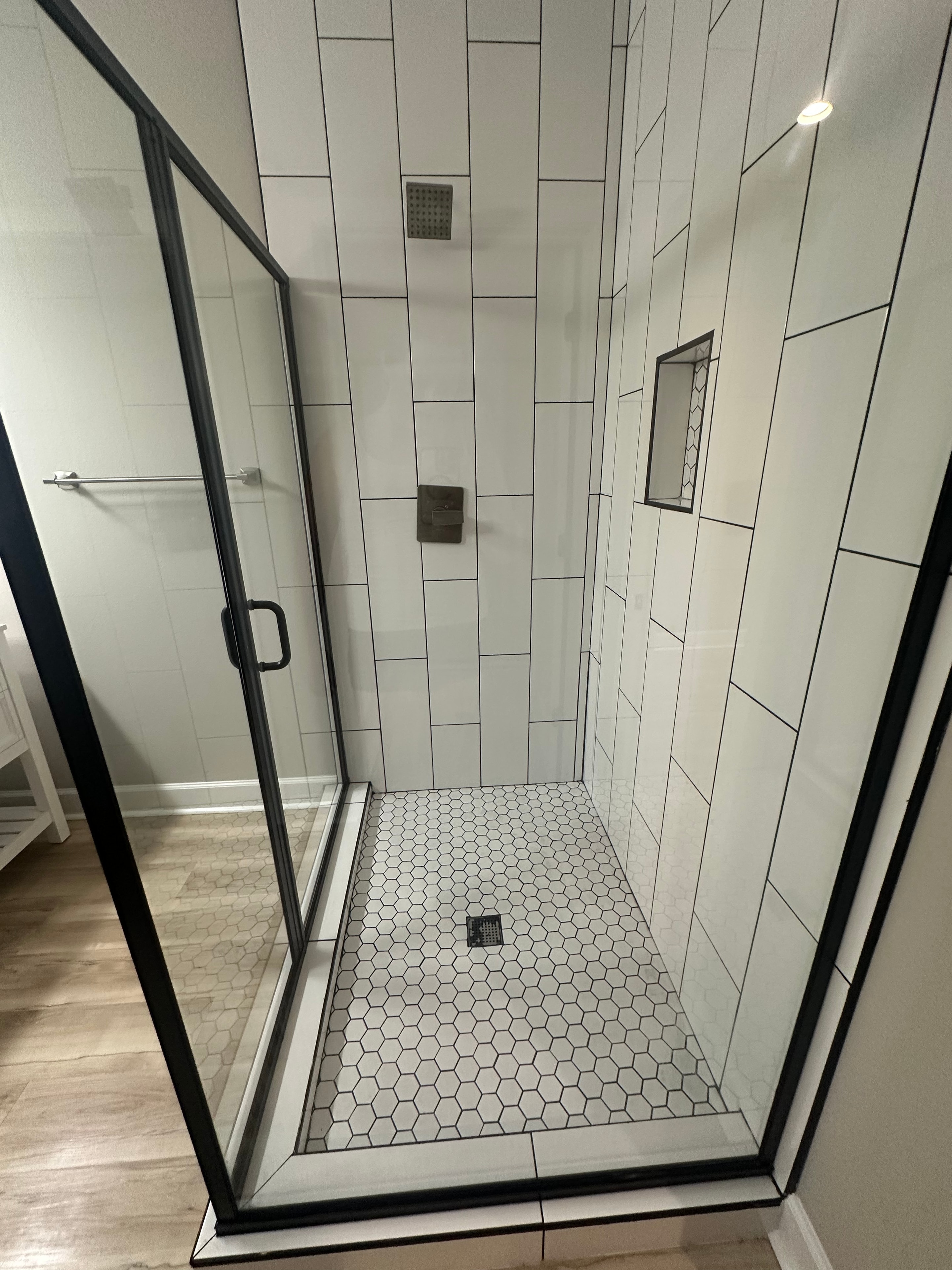 Gleaming bathroom with white tiles after cleaning